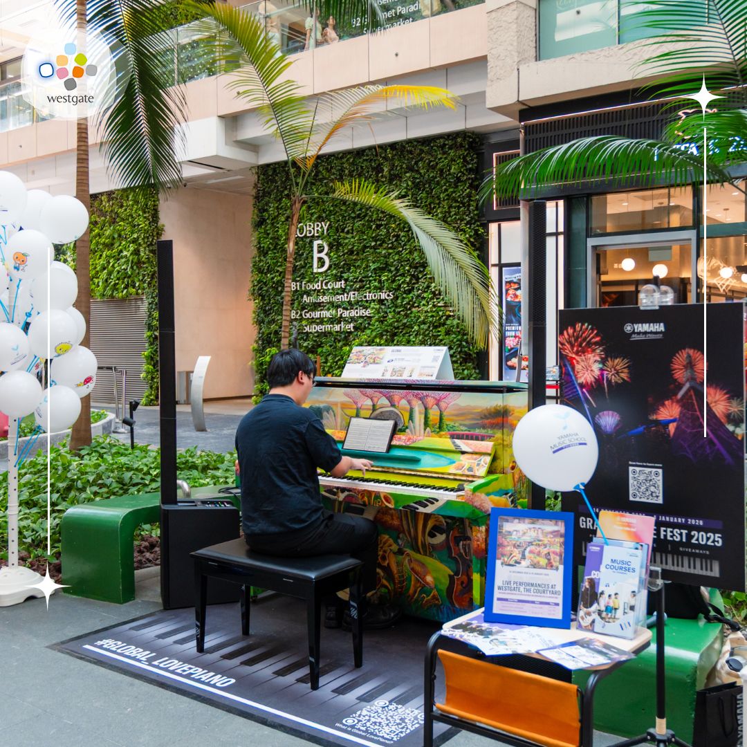 A crowd gathered around a piano, enjoying a musical performance
