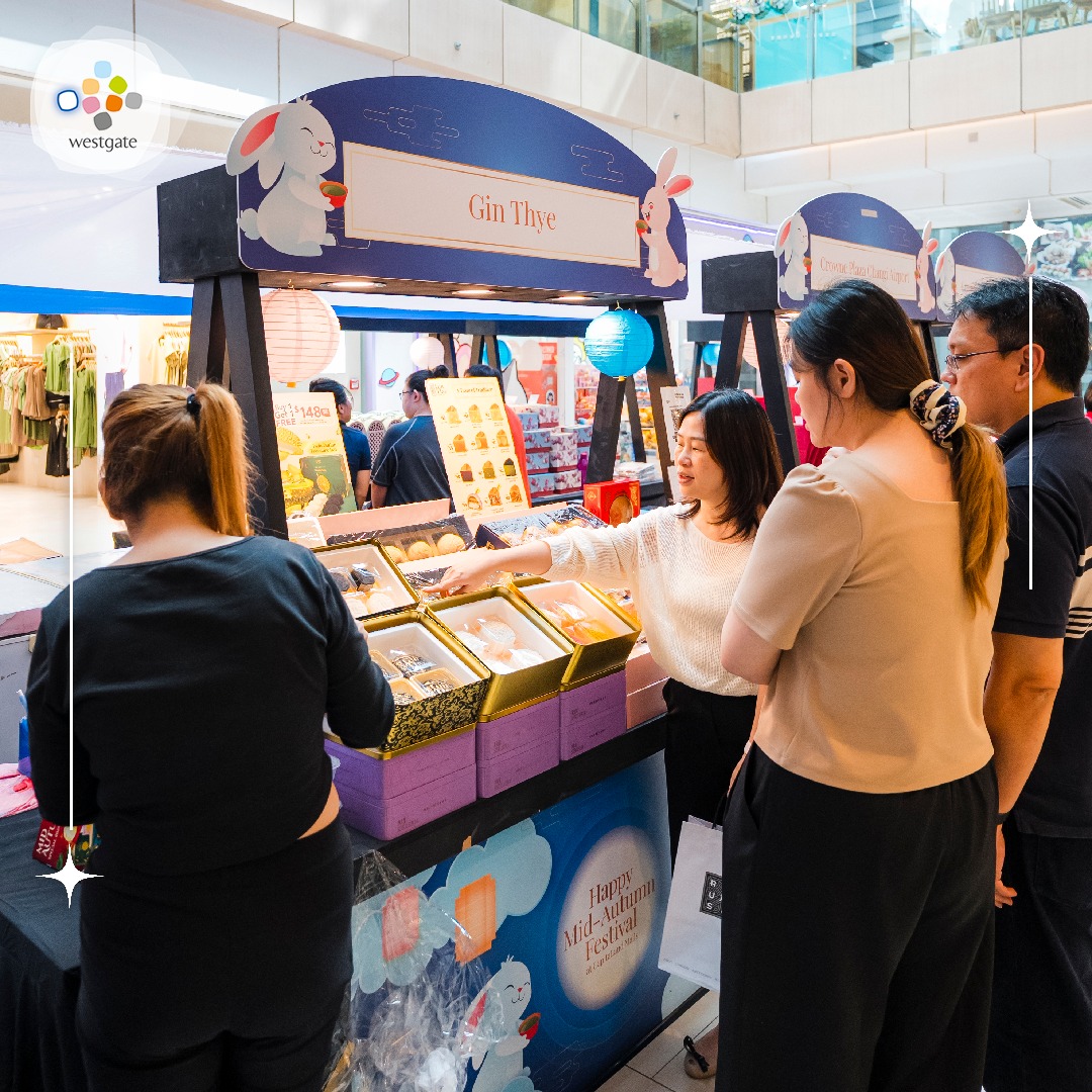 Families and friends enjoying the lively atmosphere of the Mid-Autumn Festival celebration.