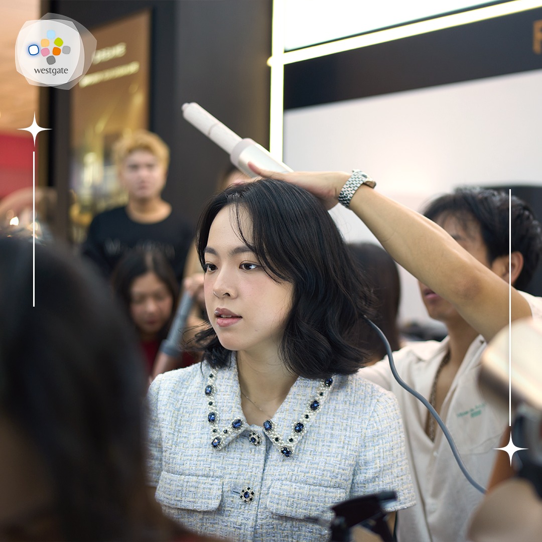 Attendees engaging in hands-on hair styling